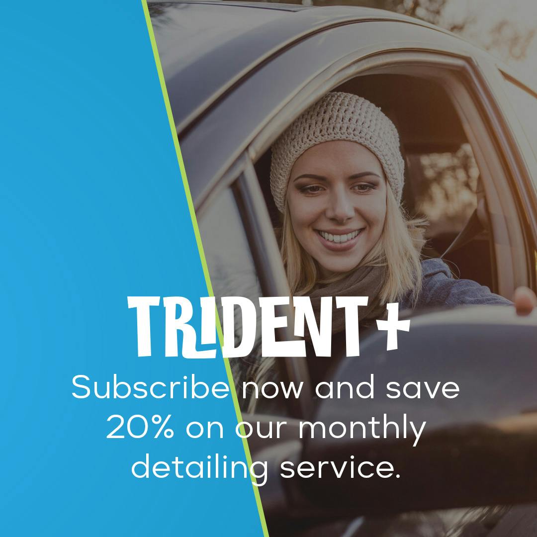 Picture of a woman adjusting her mirrors with the text "Trident+, subscribe now and save 20% on our monthly detailing service" in front.